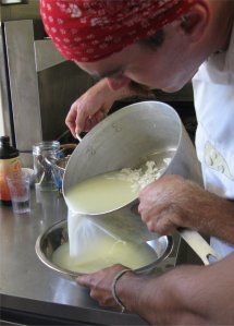 Brie ng it on. Cheese maker and organic farmer David Asher Rotsztain draining whey.
